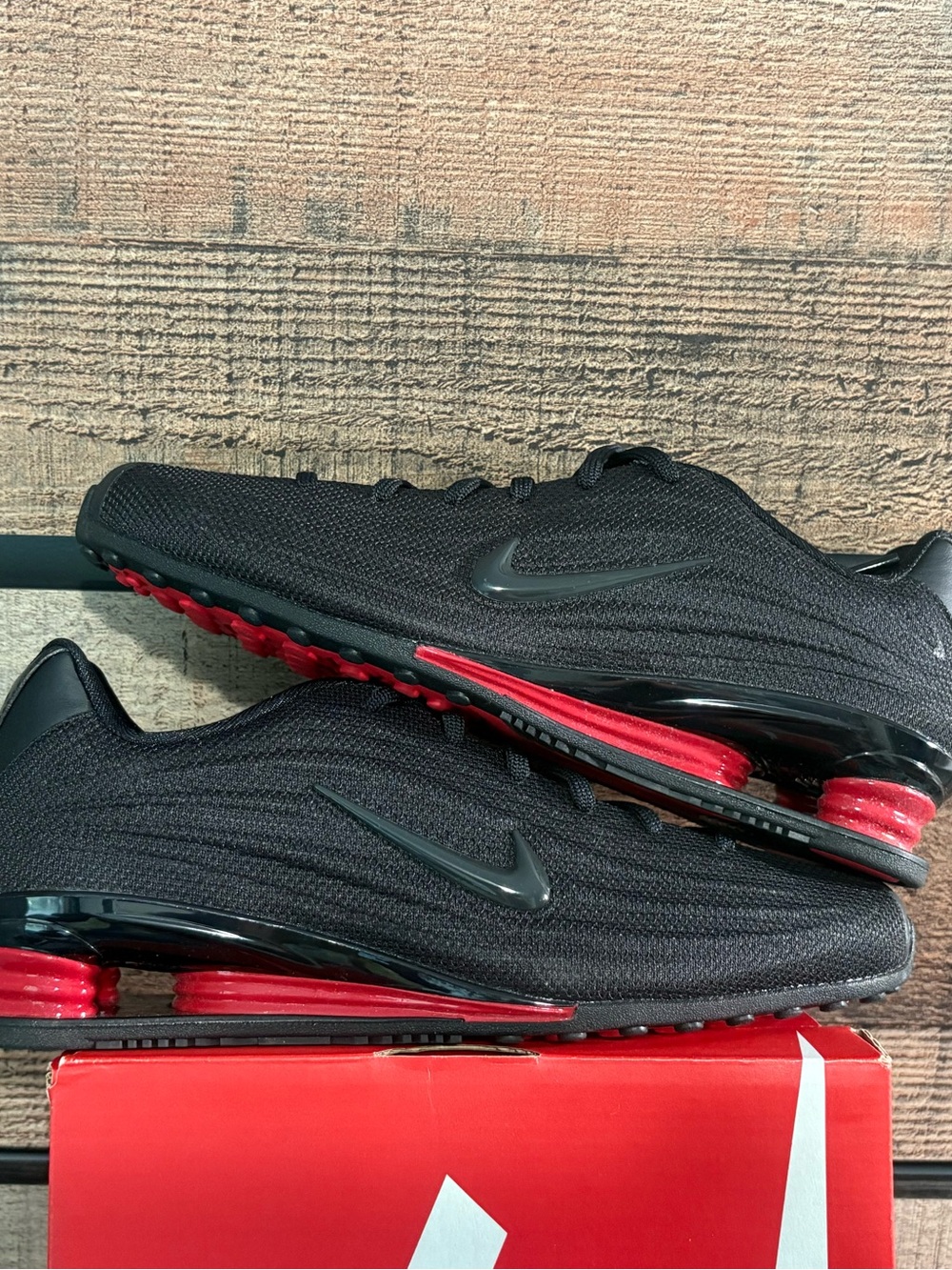 Nike Women’s Black Athletic Shoes with Red Accents unisex style and color though
